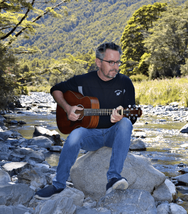 Mark-on-rock-playing-guitar-600×683